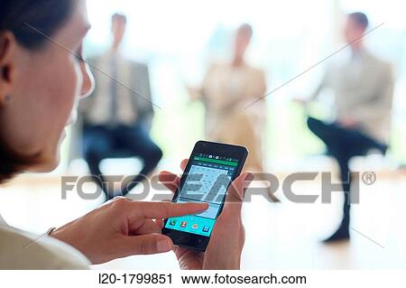 Using smartphone View Large Photo Image Stock Image - Using smartphone. Fotosearch