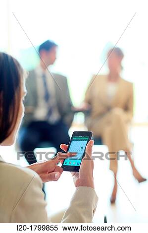 Stock Photography - Using smartphone. Fotosearch