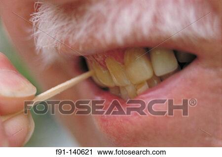 Using toothpick View Large Photo Image Stock Image - Using toothpick. Fotosearch
