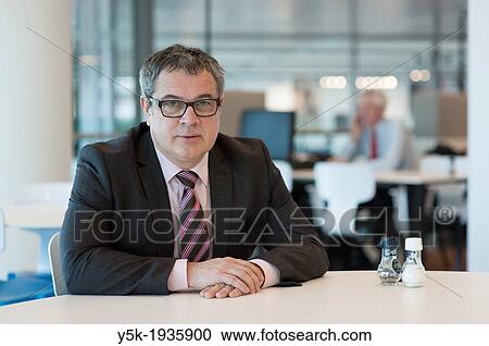 Utrecht, Netherlands. Portrait of a manager, working at a large financial institution. View Large Photo Image Stock Image - Utrecht, Netherlands. Portrait of a manager, working at a large financial institution.. Fotosearch