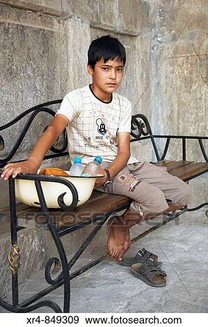 Uzbek boy at the Sher-Dor Madrasah in the Registan, Samarkand, Uzbekistan View Large Photo Image Stock Photo - Uzbek boy at the Sher-Dor Madrasah in the Registan, Samarkand, Uzbekistan. Fotosearch