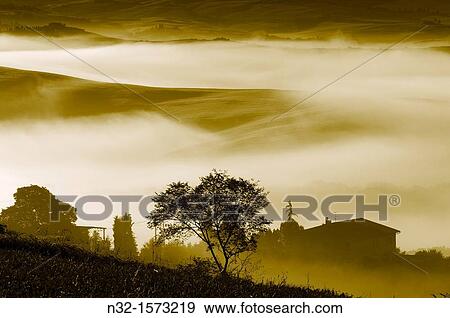 Val d? Orcia at dawn, morning fog, Tuscany landscape, UNESCO world heritage site, San Quirico d? Orcia, Siena province, Tuscany, Italy View Large Photo Image Stock Photo - Val d? Orcia at dawn, morning fog, Tuscany landscape, UNESCO world heritage site, San Quirico d? Orcia, Siena province, Tuscany, Italy. Fotosearch