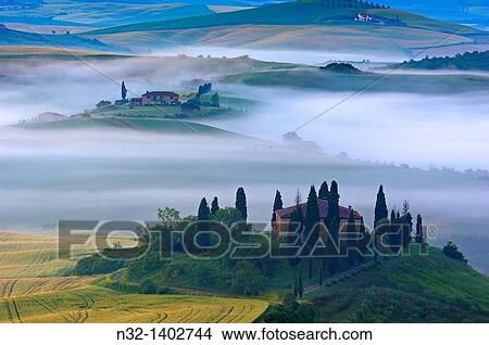 Val d? Orcia Orcia Valley Morning fog The Belvedere at dawn UNESCO World Heritage Site San Quirico d? Orcia Siena Province Tuscany Tuscany landscape Italy Europe. View Large Photo Image Picture - Val d? Orcia Orcia Valley Morning fog The Belvedere at dawn UNESCO World Heritage Site San Quirico d? Orcia Siena Province Tuscany Tuscany landscape Italy Europe.. Fotosearch