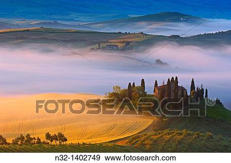 Val d? Orcia Orcia Valley Morning fog The Belvedere at dawn UNESCO World Heritage Site San Quirico d? Orcia Siena Province Tuscany Tuscany landscape Italy Europe. View Large Photo Image Stock Photo - Val d? Orcia Orcia Valley Morning fog The Belvedere at dawn UNESCO World Heritage Site San Quirico d? Orcia Siena Province Tuscany Tuscany landscape Italy Europe.. Fotosearch