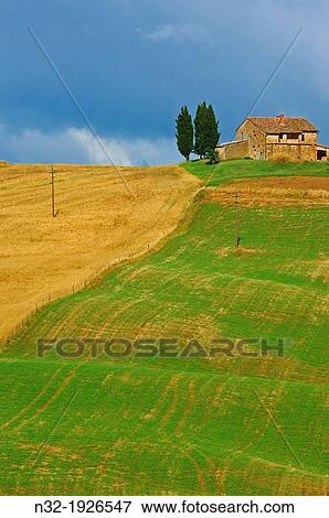 Stock Photo - Val d? Orcia, UNESCO world heritage site, Fields and farmhouses, Tuscany Landscape, Pienza, Siena Province, Tuscany, Italy. Fotosearch