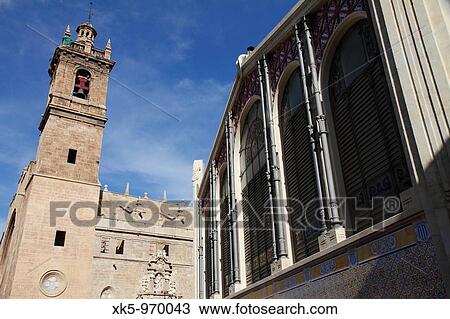 Valencia. Modernist? Mercado Central? central market building, 1914 and church, Spain View Large Photo Image Stock Image - Valencia. Modernist? Mercado Central? central market building, 1914 and church, Spain. Fotosearch