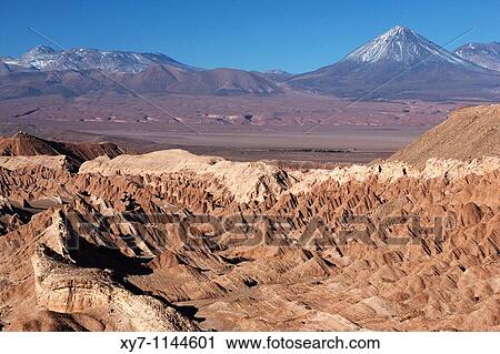 Valle de La Muerte or Death Valley with the Licancabur volcano in the background near San Pedro de Atacama in Chile View Large Photo Image Stock Image - Valle de La Muerte or Death Valley with the Licancabur volcano in the background near San Pedro de Atacama in Chile. Fotosearch