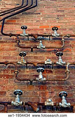 Picture - valves, pipes, Fabra and Coats, old factory, Barcelona, Catalonia, Spain.. Fotosearch