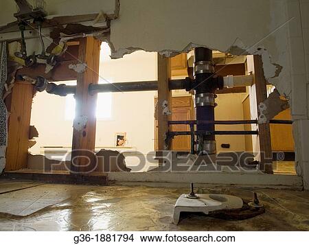 Picture - Vandalized bathroom inside a foreclosed house in Greensboro, North Carolina. Fotosearch