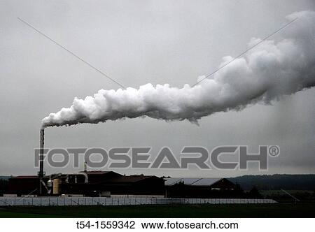 Stock Image - Vapor cloud of a food dryer from rain sky. Fotosearch
