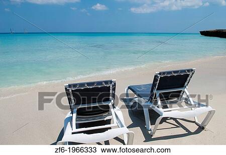 Varadero Cuba the perfect beach blue waters and chairs waiting for tourists to come on Holiday vacation. View Large Photo Image Stock Image - Varadero Cuba the perfect beach blue waters and chairs waiting for tourists to come on Holiday vacation.. Fotosearch