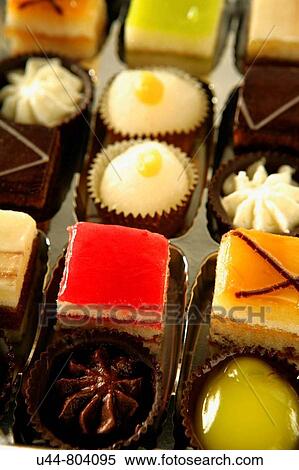 Stock Photography - Variety of little colorful cakes. Fotosearch