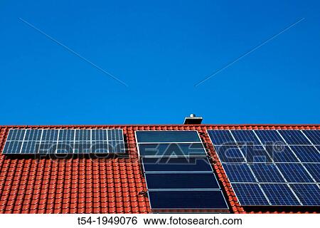 Various solar panels on a house roof View Large Photo Image Stock Photograph - Various solar panels on a house roof. Fotosearch