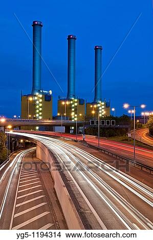 Picture - Vatenwall power plant with highway in the night, time exposure, Berlin, Germany. Fotosearch