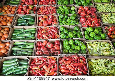 Vegetables being sold at a produce auction View Large Photo Image Stock Photo - Vegetables being sold at a produce auction. Fotosearch