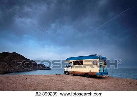 Vehicle caravan parked next to the cliff Costa del Cabo de Gata Isleta del Moro, Almer? a, Andalusia, Spain View Large Photo Image Stock Photo - Vehicle caravan parked next to the cliff Costa del Cabo de Gata Isleta del Moro, Almer? a, Andalusia, Spain. Fotosearch
