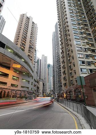 Vehicles drive on a street in Central, Hong Kong View Large Photo Image Stock Photo - Vehicles drive on a street in Central, Hong Kong. Fotosearch