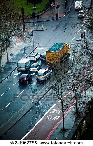 Vehicles stopped in a traffic light street crossing near Bermondsey, London, UK View Large Photo Image Stock Photography - Vehicles stopped in a traffic light street crossing near Bermondsey, London, UK. Fotosearch