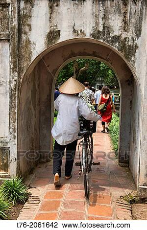 vendor and her bicycle at the Temple of Literature in Hanoi, Vietnam. View Large Photo Image Stock Image - vendor and her bicycle at the Temple of Literature in Hanoi, Vietnam.. Fotosearch
