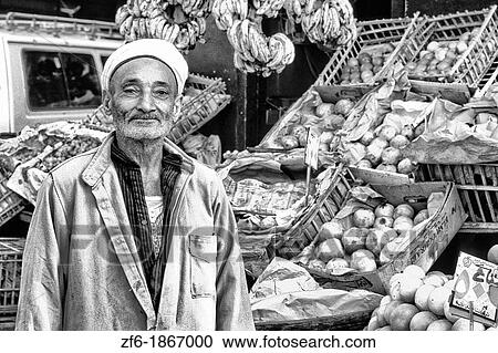 Vendor men selling fruits and vegetables in market in Cairo Egypt View Large Photo Image Stock Image - Vendor men selling fruits and vegetables in market in Cairo Egypt. Fotosearch