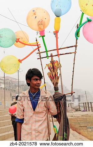 Vendor of ballons on river Ganges, Varanasi, Benares, Uttar Pradesh, India, Asia. View Large Photo Image Stock Photo - Vendor of ballons on river Ganges, Varanasi, Benares, Uttar Pradesh, India, Asia.. Fotosearch