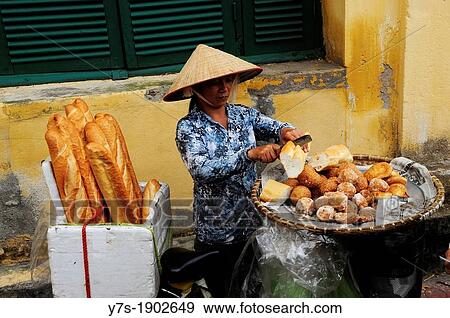Stock Photo - Vendor of bread in Hanoi, Vietnam, Asia. Fotosearch