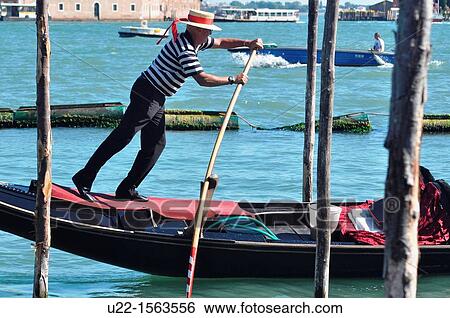 Venezia (Italy): gondoliere at work along Canale di San Marco View Large Photo Image Stock Photograph - Venezia (Italy): gondoliere at work along Canale di San Marco. Fotosearch