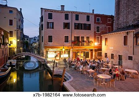 Venice. Italy. People dining outside at Il Refolo restaurant, Campiello del Piovan, San Giacomo dell Orio. View Large Photo Image Picture - Venice. Italy. People dining outside at Il Refolo restaurant, Campiello del Piovan, San Giacomo dell Orio.. Fotosearch