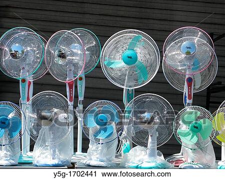Stock Image - ventilation fans in shop market stall stand outdoors. Fotosearch