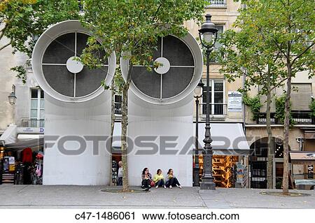 Stock Image - Ventilation structures in front of the Centre George Pompidou building on the back the rue Saint-Martin, Paris, France. Fotosearch