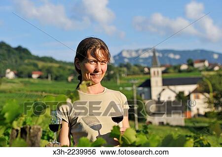 Veronique Dupasquier, wine grower, tasting wine in the vineyard at Jongieux, Savoie department, Rhone-Alpes region, France, Europe. View Large Photo Image Stock Photograph - Veronique Dupasquier, wine grower, tasting wine in the vineyard at Jongieux, Savoie department, Rhone-Alpes region, France, Europe.. Fotosearch