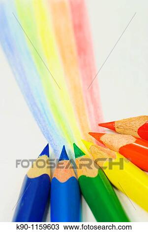 Vertical image of six colored pencils / crayons in blue, green, yellow and red color drawing a rainbow on white background. View Large Photo Image Stock Image - Vertical image of six colored pencils / crayons in blue, green, yellow and red color drawing a rainbow on white background.. Fotosearch