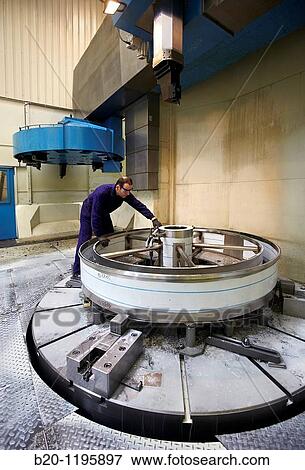 Vertical lathe for turning very large diameters and heavy workpieces, manufacture of stainless steel containers, Gipuzkoa, Euskadi, Spain View Large Photo Image Stock Photo - Vertical lathe for turning very large diameters and heavy workpieces, manufacture of stainless steel containers, Gipuzkoa, Euskadi, Spain. Fotosearch