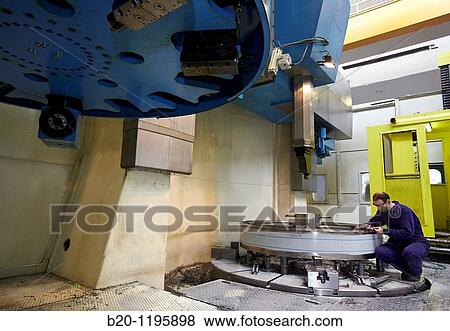 Vertical lathe for turning very large diameters and heavy workpieces, manufacture of stainless steel containers, Gipuzkoa, Euskadi, Spain View Large Photo Image Stock Photo - Vertical lathe for turning very large diameters and heavy workpieces, manufacture of stainless steel containers, Gipuzkoa, Euskadi, Spain. Fotosearch