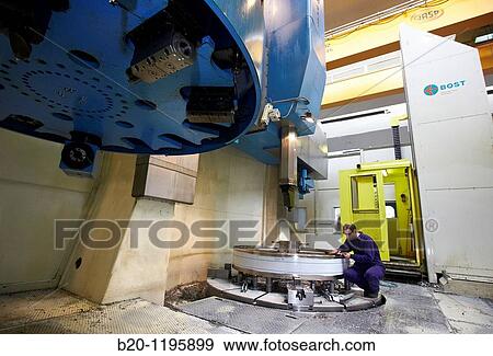 Vertical lathe for turning very large diameters and heavy workpieces, manufacture of stainless steel containers, Gipuzkoa, Euskadi, Spain View Large Photo Image Stock Photo - Vertical lathe for turning very large diameters and heavy workpieces, manufacture of stainless steel containers, Gipuzkoa, Euskadi, Spain. Fotosearch