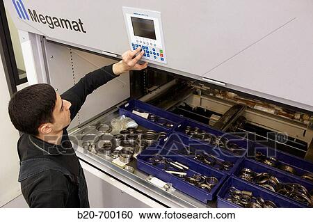 Vertical office carousel, dynamic storage system, spindle manufacturing. Mendaro, Gipuzkoa, Euskadi, Spain View Large Photo Image Stock Image - Vertical office carousel, dynamic storage system, spindle manufacturing. Mendaro, Gipuzkoa, Euskadi, Spain. Fotosearch