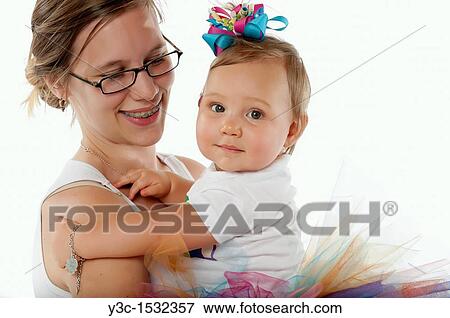 Very young mother with baby girl View Large Photo Image Stock Photo - Very young mother with baby girl. Fotosearch