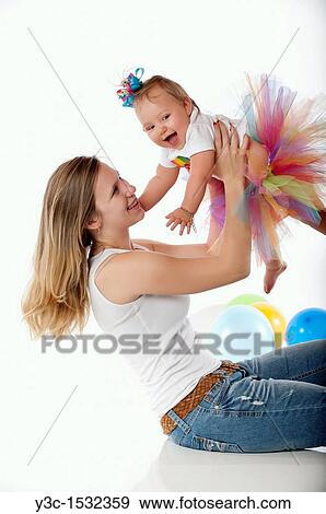 Stock Photo - Very young mother with baby girl. Fotosearch