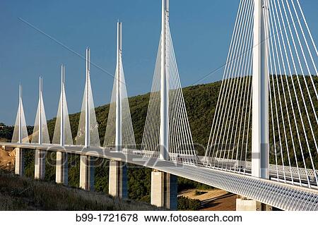 VIADUCT DE MILLAU AUTOROUTE 75 LA MERIDIEE MASSIF CENTRAL AVEYRON FRANCE View Large Photo Image Stock Photo - VIADUCT DE MILLAU AUTOROUTE 75 LA MERIDIEE MASSIF CENTRAL AVEYRON FRANCE. Fotosearch