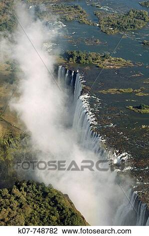 Stock Image - Victoria Falls, Zambesi River, Zambia - Zimbabwe border.. Fotosearch