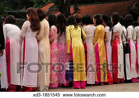 Vietnamese graduates wearing tradional dress Ao Dai at Temple of Literature, Hanoi, Vietnam View Large Photo Image Stock Photography - Vietnamese graduates wearing tradional dress Ao Dai at Temple of Literature, Hanoi, Vietnam. Fotosearch