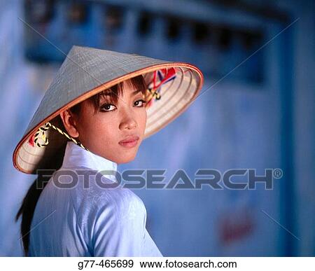 Stock Photo - Vietnamese woman in traditional dress, Ho Chi Minh City. Vietnam. Fotosearch