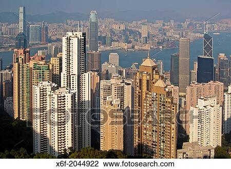 View across the skyscrapers in Central District and the Victoria Harbour to Kowloon, Hong Kong. View Large Photo Image Stock Image - View across the skyscrapers in Central District and the Victoria Harbour to Kowloon, Hong Kong.. Fotosearch