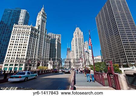 View along N Michigan Ave Bridge showing the Tribune Tower and Wrigley Building in Chicago, IL, USA View Large Photo Image Stock Image - View along N Michigan Ave Bridge showing the Tribune Tower and Wrigley Building in Chicago, IL, USA. Fotosearch