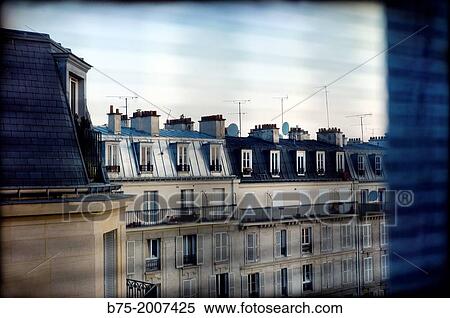Stock Photography - View from a window of apartments and garrets of a typical neighborhood of Paris, France Europe. Fotosearch