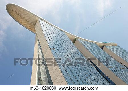Stock Image - View from below of Marina Bay Sands Hotel The hotel is part of Marina Bay Sands an integrated resort that include also casino, shopping mall and a science museum. Fotosearch