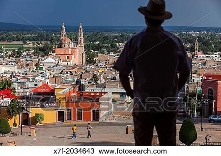 View from `El Calvario?. Man, in background Parroquia de la Asunci? n de Mar? a, Lagos de Moreno, Jalisco, Mexico. View Large Photo Image Stock Image - View from `El Calvario?. Man, in background Parroquia de la Asunci? n de Mar? a, Lagos de Moreno, Jalisco, Mexico.. Fotosearch