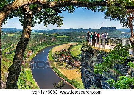 View from the spectacular rock formation Bastei Bastion to health resort Rathen and the Elbe River The Bastei is one of the most visited tourist attractions in the national park Saxon Switzerland View Large Photo Image Stock Image - View from the spectacular rock formation Bastei Bastion to health resort Rathen and the Elbe River The Bastei is one of the most visited tourist attractions in the national park Saxon Switzerland. Fotosearch