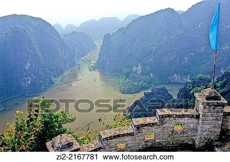 View from the top of Ngu Nhac Mountain over Tam Coc -Three Caves-. Ninh B? nh Province, Vietnam. View Large Photo Image Stock Image - View from the top of Ngu Nhac Mountain over Tam Coc -Three Caves-. Ninh B? nh Province, Vietnam.. Fotosearch