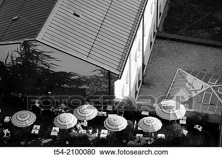 Stock Image - View from the tower of the old Peter a rooftop patio with umbrellas. Fotosearch